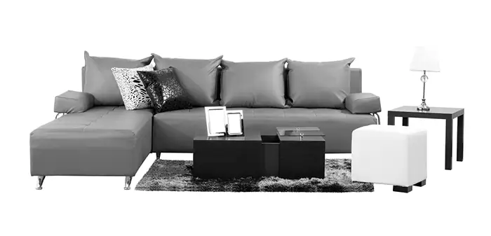 Modern grey sectional sofa with black and white accent pillows and contemporary coffee table.