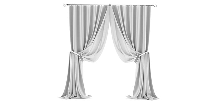 Luxurious white draped curtains for coastal home decor.